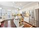 Bright kitchen with stainless steel appliances, an island, and access to an outdoor patio at 327 Alderwood Ln, Atlanta, GA 30328