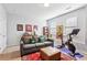 Living room with couch, Peloton exercise bike, and a decorative rug at 327 Alderwood Ln, Atlanta, GA 30328