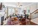 Elegant living room featuring a fireplace, hardwood floors, and recessed lighting at 327 Alderwood Ln, Atlanta, GA 30328