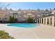 Community swimming pool with a pergola and lounge seating for relaxing at 327 Alderwood Ln, Atlanta, GA 30328