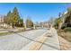View of neighborhood street featuring mature trees and well-maintained landscaping at 327 Alderwood Ln, Atlanta, GA 30328