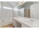 This bathroom offers double sinks, a bathtub, and a large mirror at 4284 Hathaway Nw Ct, Kennesaw, GA 30144