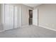 This bedroom features plush gray carpeting and a closet with bifold doors at 4284 Hathaway Nw Ct, Kennesaw, GA 30144