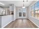 The light filled breakfast nook has views of the backyard and access to the kitchen at 4284 Hathaway Nw Ct, Kennesaw, GA 30144