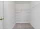 This closet features plush gray carpeting and multiple storage shelves at 4284 Hathaway Nw Ct, Kennesaw, GA 30144