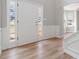 Welcoming entryway with hardwood floors, wainscoting and natural light streaming through sidelight windows at 4284 Hathaway Nw Ct, Kennesaw, GA 30144