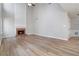 Bright living room with a soaring fireplace and hardwood floors at 4284 Hathaway Nw Ct, Kennesaw, GA 30144