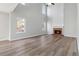 Bright living room with a soaring fireplace and hardwood floors at 4284 Hathaway Nw Ct, Kennesaw, GA 30144