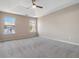 The main bedroom offers a spacious layout, neutral decor, carpet, and two large windows at 4284 Hathaway Nw Ct, Kennesaw, GA 30144