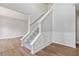 Classic staircase design with white trim and grey carpet at 4284 Hathaway Nw Ct, Kennesaw, GA 30144