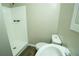 Bright bathroom featuring a shower, toilet, sink, and modern flooring at 1995 Northerly Way, Stone Mountain, GA 30088