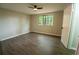 Bedroom featuring wood flooring, ceiling fan, and door at 1995 Northerly Way, Stone Mountain, GA 30088