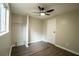 Bedroom features wood flooring, closet and ceiling fan at 1995 Northerly Way, Stone Mountain, GA 30088