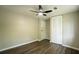 Cozy bedroom features a built-in closet, light wood floors and a modern ceiling fan at 1995 Northerly Way, Stone Mountain, GA 30088