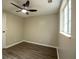 Bedroom featuring window, ceiling fan and door at 1995 Northerly Way, Stone Mountain, GA 30088