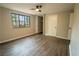 Comfortable bedroom featuring wood-look floors and a window view at 1995 Northerly Way, Stone Mountain, GA 30088