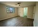 Bedroom offers natural light with a window, ceiling fan and closet at 1995 Northerly Way, Stone Mountain, GA 30088