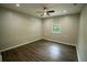 Bright bedroom featuring laminate flooring, a ceiling fan, and a window with natural light at 1995 Northerly Way, Stone Mountain, GA 30088