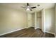 Bright bedroom features a built-in closet with light wood floors and modern ceiling fan at 1995 Northerly Way, Stone Mountain, GA 30088