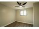 Cozy bedroom with a ceiling fan, window, and wood flooring at 1995 Northerly Way, Stone Mountain, GA 30088