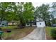 Charming home exterior with a driveway and well-maintained front yard at 1995 Northerly Way, Stone Mountain, GA 30088