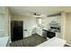 Bright kitchen featuring modern appliances, white cabinets, and plenty of counter space, perfect for cooking and entertaining at 1995 Northerly Way, Stone Mountain, GA 30088