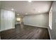 Spacious living area features new laminate flooring, recessed lighting, and an open layout for flexible furniture arrangement at 1995 Northerly Way, Stone Mountain, GA 30088