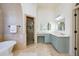 Stylish bathroom featuring a walk-in shower, soaking tub and a vanity with plenty of cabinets at 2760 Sugarloaf Club Dr, Duluth, GA 30097