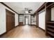 Bedroom with built-in shelves and hardwood floors at 2760 Sugarloaf Club Dr, Duluth, GA 30097