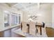 Elegant dining room featuring coffered ceilings, hardwood floors, and large windows at 2760 Sugarloaf Club Dr, Duluth, GA 30097