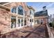 Exterior view showing the brick facade and large wooden deck at 2760 Sugarloaf Club Dr, Duluth, GA 30097