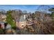 Expansive backyard view showcasing the home's architectural design and outdoor space with a covered patio at 2760 Sugarloaf Club Dr, Duluth, GA 30097