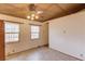 Bright bedroom with neutral walls, tile floors, and natural light from two windows at 2762 Zingara Ne Rd, Conyers, GA 30012