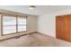 Bedroom with neutral walls and carpet flooring and natural light at 2762 Zingara Ne Rd, Conyers, GA 30012