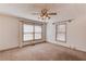 Neutral bedroom with natural light from two windows, offering a cozy atmosphere at 2762 Zingara Ne Rd, Conyers, GA 30012