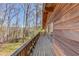 A wooden deck surrounded by trees, offering an outdoor area at 2762 Zingara Ne Rd, Conyers, GA 30012