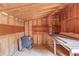 Interior of shed featuring wood walls, shelves, and a workbench at 2762 Zingara Ne Rd, Conyers, GA 30012