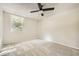 Neutral bedroom featuring a ceiling fan and a large window for ample natural light at 2965 Pharr Court South Nw # 110, Atlanta, GA 30305