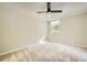 Neutral bedroom featuring a ceiling fan and a large window for ample natural light at 2965 Pharr Court South Nw # 110, Atlanta, GA 30305