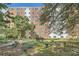 Brick building with well-maintained landscaping, benches, and walkways for residents to enjoy at 2965 Pharr Court South Nw # 110, Atlanta, GA 30305