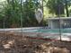 A chain link fence surrounding the community pool with lounge chairs and a bathroom nearby at 2965 Pharr Court South Nw # 110, Atlanta, GA 30305