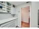 Pantry area with custom shelving and white cabinets in the kitchen at 2965 Pharr Court South Nw # 110, Atlanta, GA 30305