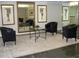 Apartment building lobby with mirrored wall, artwork, leather chairs and tiled floor at 2965 Pharr Court South Nw # 110, Atlanta, GA 30305