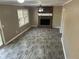 Comfortable living room featuring a brick fireplace, neutral walls and sleek floors at 4502 Cherie Glen Trl, Stone Mountain, GA 30083