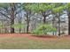 Backyard area with views of trees and lawn at 4607 Ravenwood Loop, Union City, GA 30291