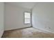 Bedroom featuring carpeted floors, neutral walls, and a window providing natural light at 4607 Ravenwood Loop, Union City, GA 30291