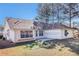 Wide backyard with lawn featuring mature trees and a concrete patio area at 11941 Fairway Overlook, Fayetteville, GA 30215