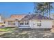 Well-maintained backyard features a patio area and mature trees at 11941 Fairway Overlook, Fayetteville, GA 30215