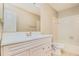 A bathroom with a white vanity, large mirror and a shower/tub combo at 11941 Fairway Overlook, Fayetteville, GA 30215