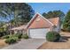 Charming home with a two-car garage, brick accents, and well-maintained landscaping at 11941 Fairway Overlook, Fayetteville, GA 30215